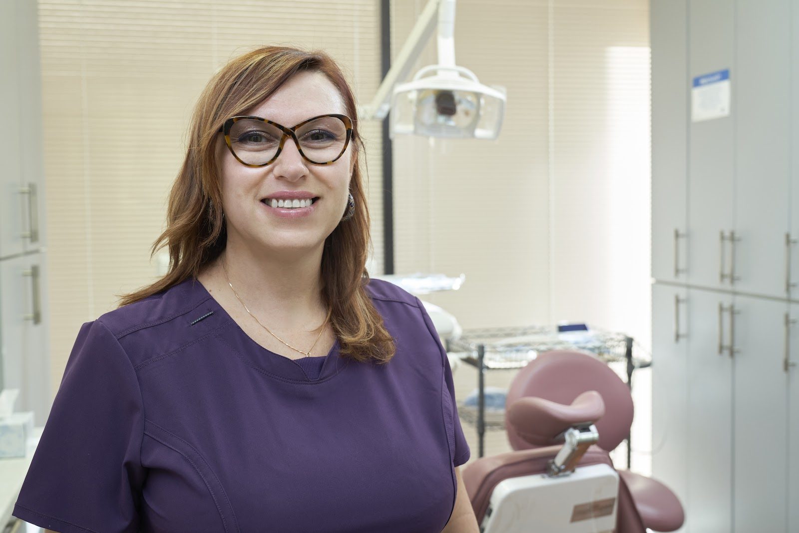 Dr. Victoria Prasol smiling in her treatment room at Saugus Dental Laser Center
