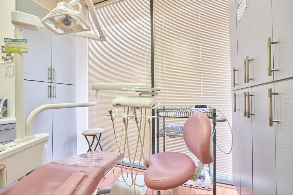 Treatment room at Saugus Dental Laser Center with the laser operating sign